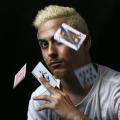 man with cards flying in front of him